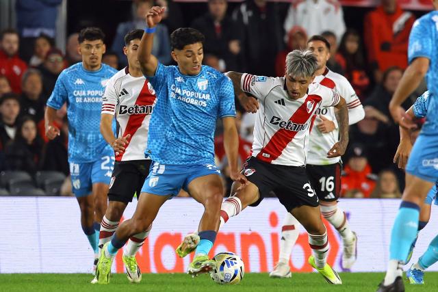 Tucuman’s defender #19 Ignacio Galvan and River Plate's forward #32 Agustin Ruberto fight for the ball during the Argentine Professional Football League 2026 Apertura tournament match between River Plate and Atletico Tucuman, at the Mas Monumental stadium in Buenos Aires on May 3, 2026. (Photo by ALEJANDRO PAGNI / AFP)