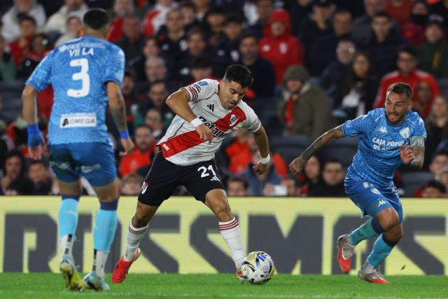 River Plate's defender #21 Marcos Acuna fights for the ball with Tucuman’s defender #3 Maximiliano Villa and Tucuman’s midfielder #11 Renzo Tesuri during the Argentine Professional Football League 2026 Apertura tournament match between River Plate and Atletico Tucuman, at the Mas Monumental stadium in Buenos Aires on May 3, 2026. (Photo by ALEJANDRO PAGNI / AFP)