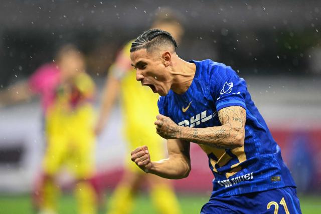 Pumas' midfielder #21 Uriel Antuna celebrates scoring his team's first goal during the Mexican League Clausura Tournament quarterfinal first leg football match between America and Pumas, at the Azteca stadium in Mexico City on May 3, 2026. (Photo by Carl DE SOUZA / AFP)