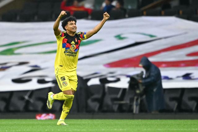 America's forward #12 Isaias Violante celebrates scoring his team's first goal during the Mexican League Clausura Tournament quarterfinal first leg football match between America and Pumas, at the Azteca stadium in Mexico City on May 3, 2026. (Photo by Carl DE SOUZA / AFP)