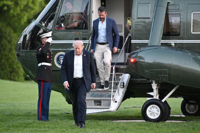 US President Donald Trump, followed by Donald Trump Jr., steps off Marine One upon his return to the White House in Washington, DC, on May 3, 2026. Trump spent the weekend at his Mar-a-Lago resort in Palm Beach, Florida and his Doral Miami resort. (Photo by Mandel NGAN / AFP)
