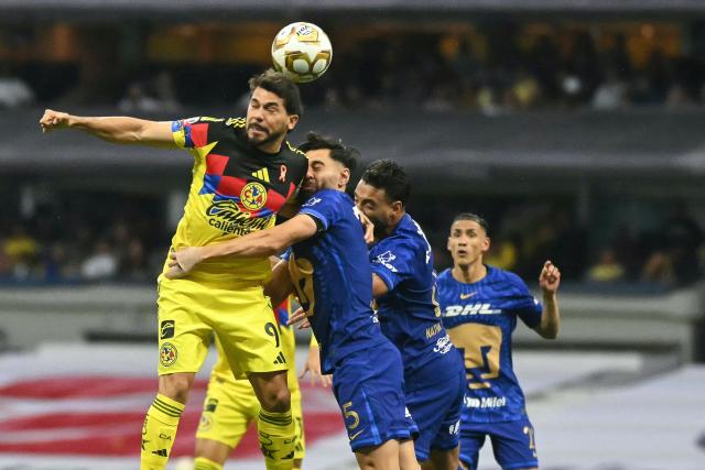 America's forward #09 Henry Martin and Pumas' Spanish defender #05 Ruben Duarte jump for a header during the Mexican League Clausura Tournament quarterfinal first leg football match between America and Pumas, at the Azteca stadium in Mexico City on May 3, 2026. (Photo by CARL DE SOUZA / AFP)