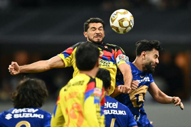 America's forward #09 Henry Martin and Pumas' Spanish defender #05 Ruben Duarte jump for a header during the Mexican League Clausura Tournament quarterfinal first leg football match between America and Pumas, at the Azteca stadium in Mexico City on May 3, 2026. (Photo by CARL DE SOUZA / AFP)