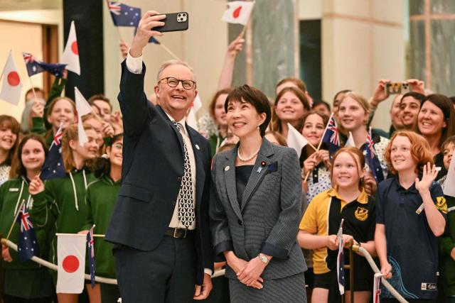 Australia's Prime Minister Anthony Albanese (L) and Japan's Prime Minister Sanae Takaichi pose for photographs during a welcome ceremony at Parliament House in Canberra on May 4, 2026. (Photo by Saeed Khan / AFP)