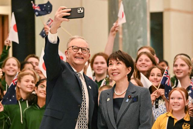 Australia's Prime Minister Anthony Albanese (L) and Japan's Prime Minister Sanae Takaichi pose for photographs during a welcome ceremony at Parliament House in Canberra on May 4, 2026. (Photo by Saeed Khan / AFP)