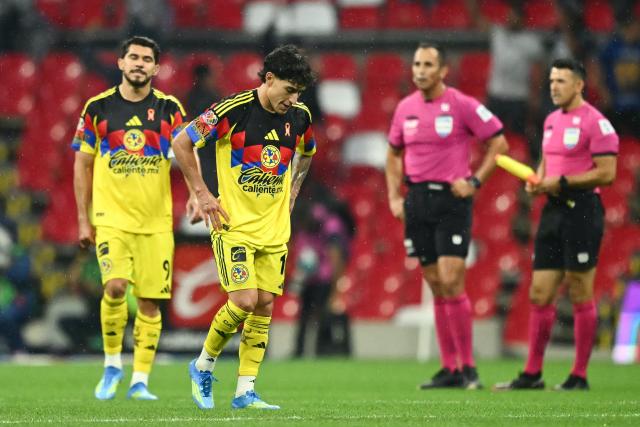 America's forward #09 Henry Martin and America's US forward #10 Alejandro Zendejas react at the end of the Mexican League Clausura Tournament quarterfinal first leg football match between America and Pumas, at the Azteca stadium in Mexico City on May 3, 2026. (Photo by CARL DE SOUZA / AFP)