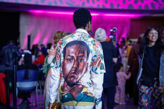 People attend "The People's Ball" at Brooklyn Public Library's Central Branch in Brooklyn, New York on May 3, 2026. "The People's Ball" offers an alternative to the Met Gala, allowing people to express their person styles. (Photo by kena betancur / AFP)