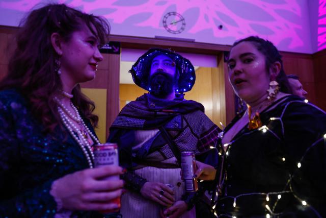 People attend "The People's Ball" at Brooklyn Public Library's Central Branch in Brooklyn, New York on May 3, 2026. "The People's Ball" offers an alternative to the Met Gala, allowing people to express their person styles. (Photo by kena betancur / AFP)