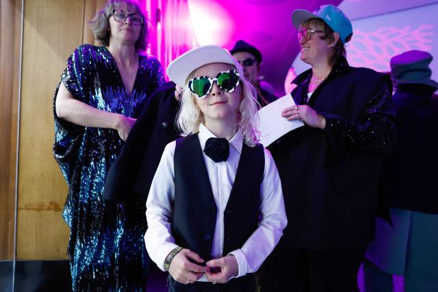 People attend "The People's Ball" at Brooklyn Public Library's Central Branch in Brooklyn, New York on May 3, 2026. "The People's Ball" offers an alternative to the Met Gala, allowing people to express their person styles. (Photo by kena betancur / AFP)