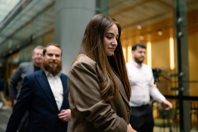 Sheina Gutnick, whose father was killed in a mass shooting at Bondi Beach, leaves the building after the first hearing block of the Royal Commission on Antisemitism and Social Cohesion in Sydney on May 4, 2026. An Australian inquiry opened public hearings on May 4 into an antisemitic shooting that killed 15 people at a Jewish festival on Sydney's Bondi Beach. (Photo by GEORGE CHAN / AFP)
