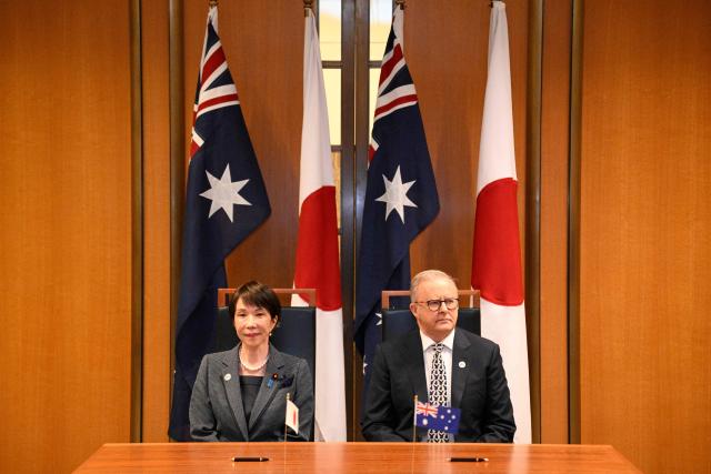 Japan's Prime Minister Sanae Takaichi (L) and Australia's Prime Minister Anthony Albanese are seated before taking part in a signing ceremony for a joint declaration of economic security cooperation at Parliament House in Canberra on May 4, 2026. (Photo by Saeed KHAN / AFP)