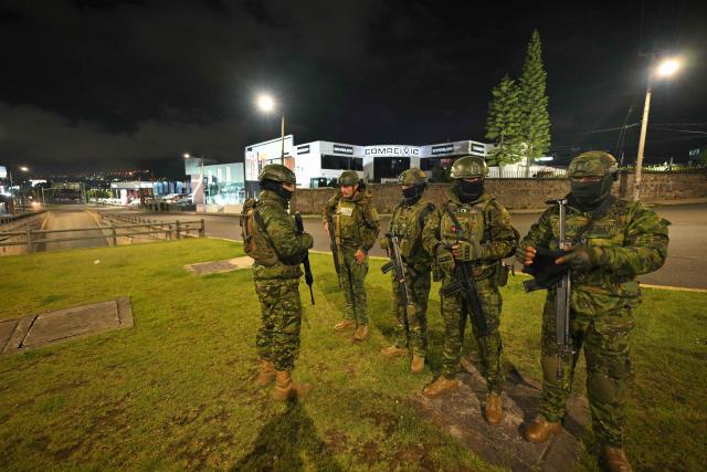 Members of Ecuadorian militar stand guard following a curfew imposed by Ecuador's President Daniel Noboa in Quito on May 3, 2026. (Photo by Rodrigo BUENDIA / AFP)