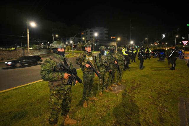 Members of Ecuadorian militar stand guard following a curfew imposed by Ecuador's President Daniel Noboa in Quito on May 3, 2026. (Photo by Rodrigo BUENDIA / AFP)