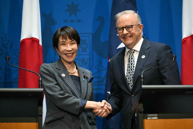 Australia's Prime Minister Anthony Albanese (R) shakes hands with Japan's Prime Minister Sanae Takaichi after speaking to the press at Parliament House in Canberra on May 4, 2026. (Photo by Saeed Khan / AFP)
