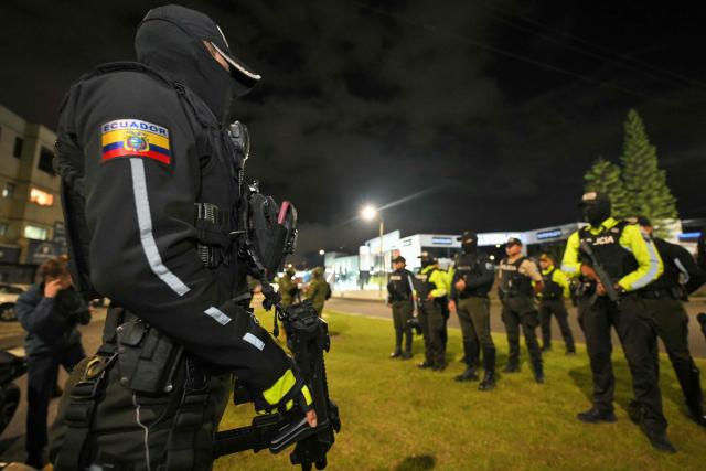 Ecuadorian police officers patrol the streets following a curfew imposed by Ecuador’s President Daniel Noboa in Quito on May 3, 2026. (Photo by Rodrigo BUENDIA / AFP)