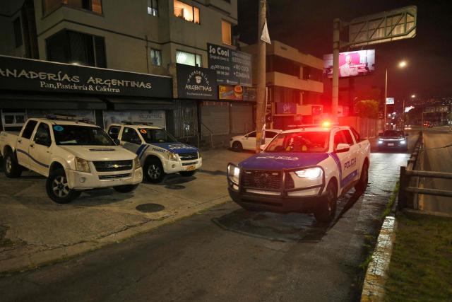 An Ecuadorian police unit patrols a street following a curfew imposed by Ecuador’s President Daniel Noboa in Quito on May 3, 2026. (Photo by Rodrigo BUENDIA / AFP)