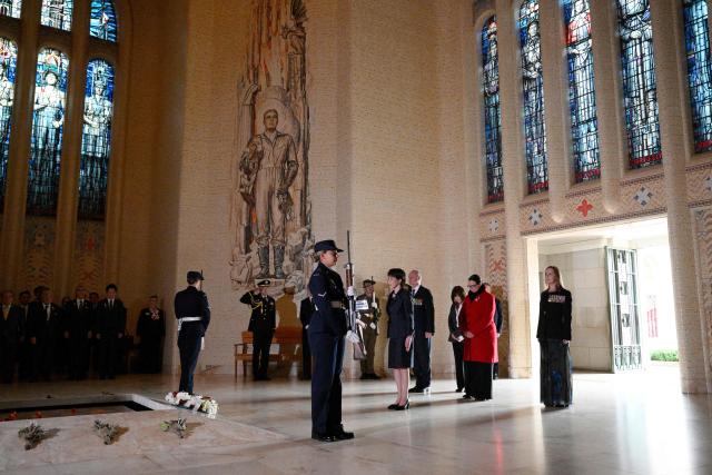 Japan's Prime Minister Sanae Takaichi (C) pays her respects at the Tomb of the Unknown Soldier during her visit to the Australian War Memorial in Canberra on May 4, 2026. (Photo by Saeed KHAN / AFP)