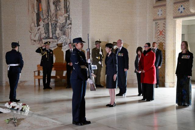Japan's Prime Minister Sanae Takaichi (C) pays her respects at the Tomb of the Unknown Soldier during her visit to the Australian War Memorial in Canberra on May 4, 2026. (Photo by Saeed KHAN / AFP)