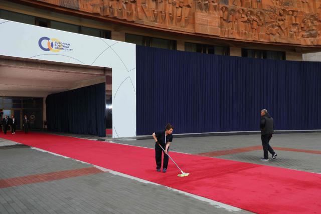 Cleaners prepare the arrival zone ahead of the 8th European Political Community (EPC) summit in Yerevan on May 4, 2026. (Photo by Ludovic MARIN / AFP)