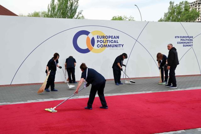 Cleaners prepare the arrival zone ahead of the 8th European Political Community (EPC) summit in Yerevan on May 4, 2026. (Photo by Ludovic MARIN / AFP)