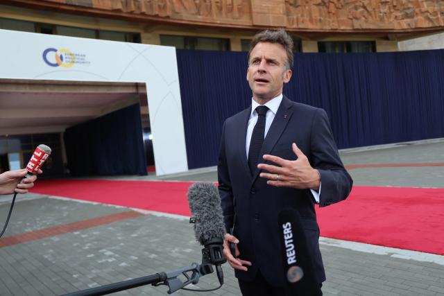 France's President Emmanuel Macron talks to the media as he arrives to attend the 8th European Political Community (EPC) summit in Yerevan on May 4, 2026. (Photo by Ludovic MARIN / AFP)