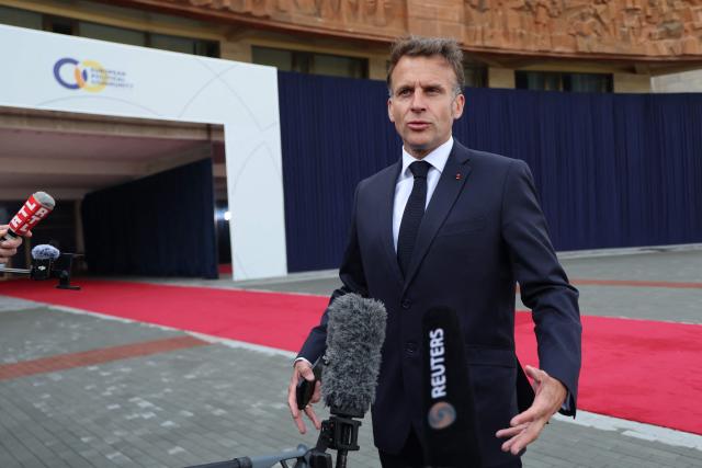 France's President Emmanuel Macron talks to the media as he arrives to attend the 8th European Political Community (EPC) summit in Yerevan on May 4, 2026. (Photo by Ludovic MARIN / AFP)
