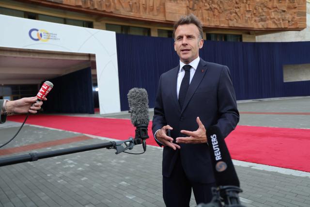 France's President Emmanuel Macron talks to the media as he arrives to attend the 8th European Political Community (EPC) summit in Yerevan on May 4, 2026. (Photo by Ludovic MARIN / AFP)