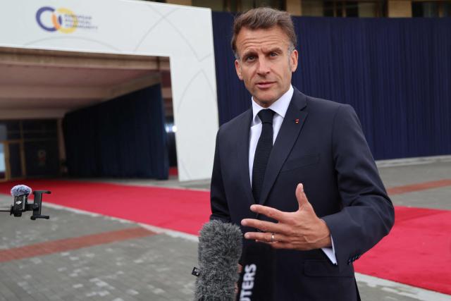 France's President Emmanuel Macron talks to the media as he arrives to attend the 8th European Political Community (EPC) summit in Yerevan on May 4, 2026. (Photo by Ludovic MARIN / AFP)