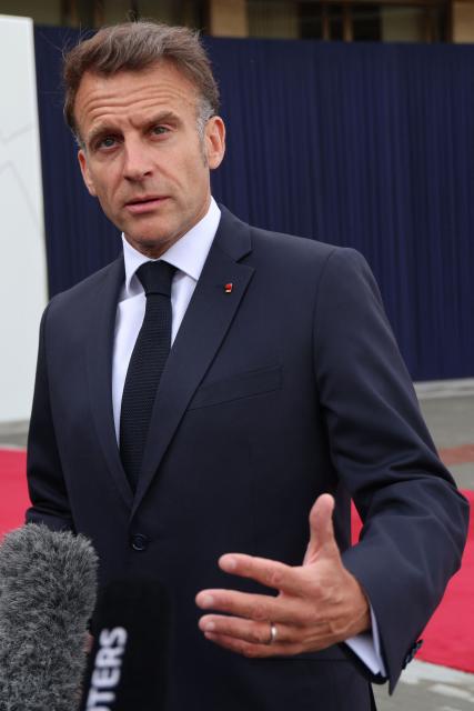 France's President Emmanuel Macron talks to the media as he arrives to attend the 8th European Political Community (EPC) summit in Yerevan on May 4, 2026. (Photo by Ludovic MARIN / AFP)