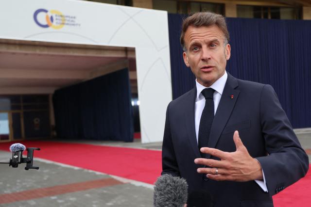 France's President Emmanuel Macron talks to the media as he arrives to attend the 8th European Political Community (EPC) summit in Yerevan on May 4, 2026. (Photo by Ludovic MARIN / AFP)