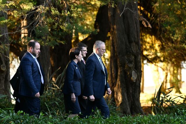 Japan's Prime Minister Sanae Takaichi (C), Australia's Prime Minister Anthony Albanese (R), and Australian Capital Territory Chief Minister Andrew Barr (L) visit the Canberra Nara Peace Park in Canberra on May 4, 2026. (Photo by Saeed Khan / AFP)