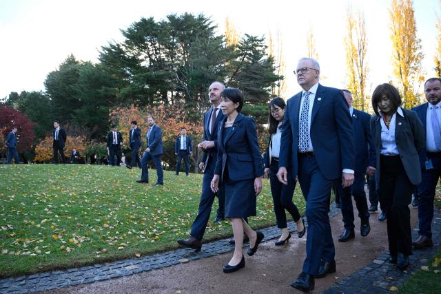 Japan's Prime Minister Sanae Takaichi (C), Australia's Prime Minister Anthony Albanese (front R), and Australian Capital Territory Chief Minister Andrew Barr (front L) leave after taking part in a tree planting ceremony at the Canberra Nara Peace Park in Canberra on May 4, 2026. (Photo by Saeed KHAN / AFP)