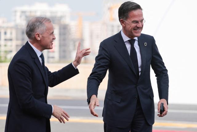 Canada's Prime Minister Mark Carney and NATO Secretary General Mark Rutte arrive to attend the 8th European Political Community (EPC) summit in Yerevan on May 4, 2026. (Photo by Ludovic MARIN / AFP)