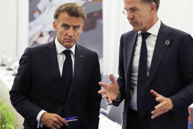 France's President Emmanuel Macron listens to NATO Secretary General Mark Rutte during a trilateral meeting with Britain's Prime Minister on the sidelines of the 8th European Political Community (EPC) summit in Yerevan on May 4, 2026. (Photo by Ludovic MARIN / AFP)