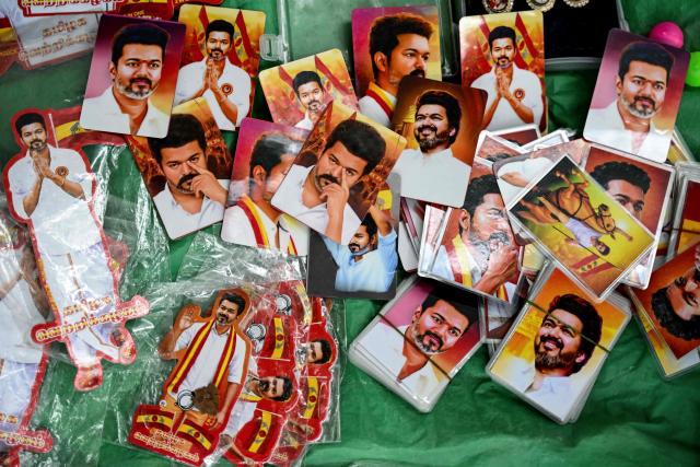 A vendor sells pictures of Indian actor and Tamilaga Vettri Kazhagam (TVK) party president C. Joseph Vijay during vote counting for the Tamil Nadu Legislative Assembly elections, at the party headquarters in Chennai on May 4, 2026. Vote counting in key Indian state elections was underway on May 4 under tight security with veteran politician MK Stalin trailing in the southern state of Tamil Nadu, challenged by a political debutante -- film star C. Joseph Vijay. (Photo by R. Satish BABU / AFP)