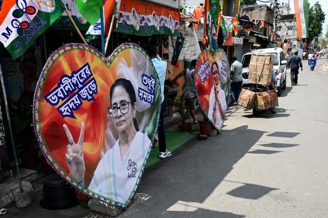 Posters featuring West Bengal chief minister and All India Trinamool Congress (TMC) party chairperson Mamata Banerjee are placed along a street leading to her residence in Kolkata on May 4, 2026 during vote counting for the West Bengal Legislative Assembly elections. Vote counting in key Indian state elections was underway on May 4 under tight security, with the focus on West Bengal, where Prime Minister Narendra Modi's party appeared set for victory. (Photo by Dibyangshu SARKAR / AFP)