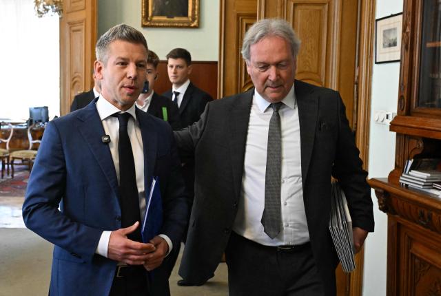 The leader of Hungary's Tisza Party, Prime Minister elect Peter Magyar (L) arrives with the President of the Hungarian Academy of Sciences (MTA) Tamas Freund (R) at the headquarters of MTA in Budapest, Hungary, on May 4, 2026, during celebrations of the institution's 200th anniversary. (Photo by Attila KISBENEDEK / AFP)
