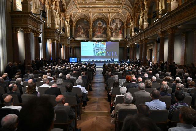 The President of the Hungarian Academy of Sciences (MTA) Tamas Freund (C-R) gives a speech at the grand hall of the Hungarian Academy of Sciences (MTA) in Budapest, Hungary, on May 4, 2026, during celebrations to mark the institution's 200th anniversary. (Photo by Attila KISBENEDEK / AFP)