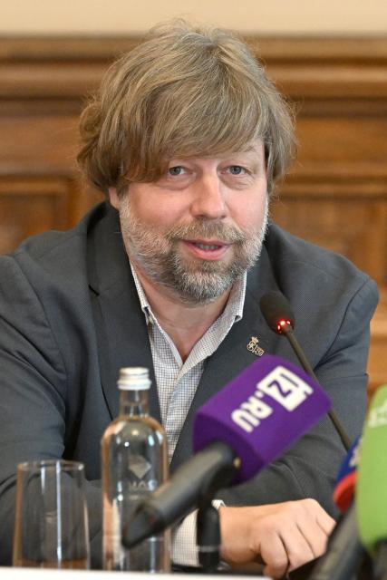 Russian archaeologist Alexander Butyagin, the head of the archaeology department at the Hermitage Museum who was arrested last December in Poland and wanted in Ukraine for conducting excavations in Crimea, holds a press conference after being freed in the last week's US-brokered deal on prisoners exchange between Belarus and European countries, at the State Hermitage Museum in Saint Petersburg on May 4, 2026. (Photo by Olga MALTSEVA / AFP)
