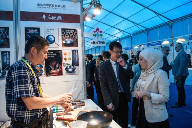 Visitors attend the 24th Pyongyang Spring International Trade Fair opening at the Central Youth Hall in Pyongyang on May 4, 2026. (Photo by KIM Won Jin / AFP)