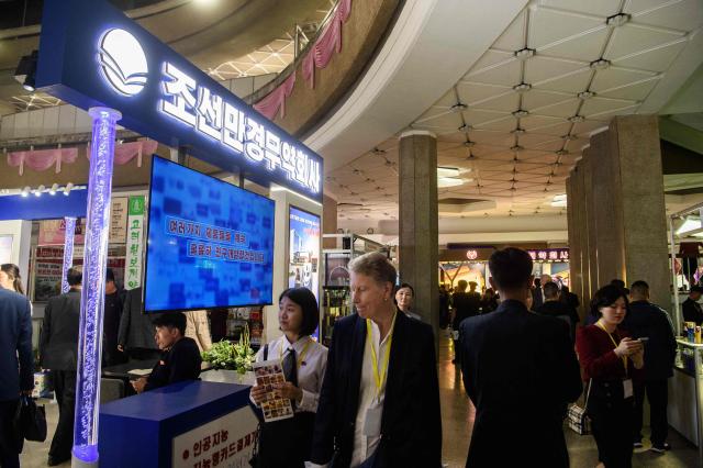 Visitors attend the 24th Pyongyang Spring International Trade Fair opening at the Central Youth Hall in Pyongyang on May 4, 2026. (Photo by KIM Won Jin / AFP)