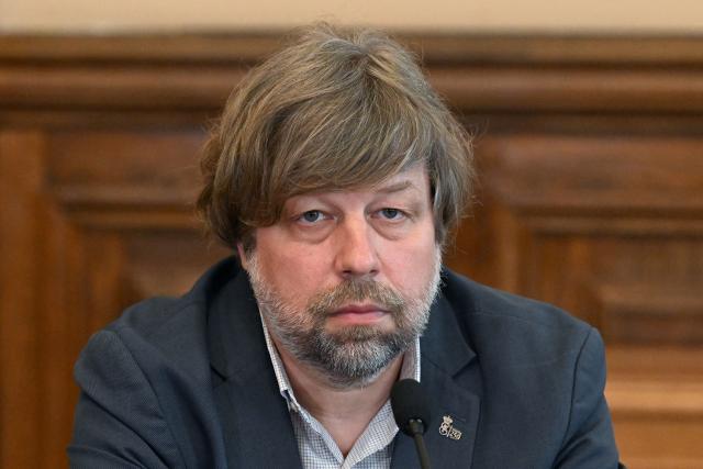 Russian archaeologist Alexander Butyagin, the head of the archaeology department at the Hermitage Museum who was arrested last December in Poland and wanted in Ukraine for conducting excavations in Crimea, holds a press conference after being freed in the last week's US-brokered deal on prisoners exchange between Belarus and European countries, at the State Hermitage Museum in Saint Petersburg on May 4, 2026. (Photo by Olga MALTSEVA / AFP)