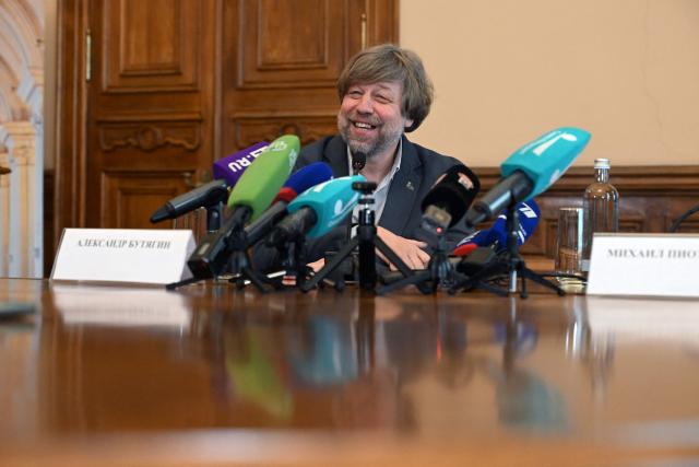 Russian archaeologist Alexander Butyagin, the head of the archaeology department at the Hermitage Museum who was arrested last December in Poland and wanted in Ukraine for conducting excavations in Crimea, holds a press conference after being freed in the last week's US-brokered deal on prisoners exchange between Belarus and European countries, at the State Hermitage Museum in Saint Petersburg on May 4, 2026. (Photo by Olga MALTSEVA / AFP)