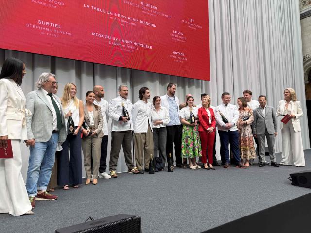 Chefs of New Michelin One Star restaurants stand on the podium during the presentation of the new edition of the Michelin 2026 restaurant and hotel guide for Belgium and Luxembourg, in Antwerp on May 4, 2026. (Photo by MAARTEN WEYNANTS / Belga / AFP) / Belgium OUT