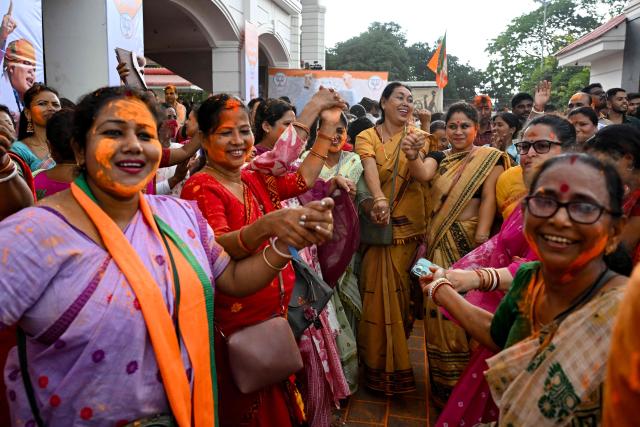 Bharatiya Janata Party (BJP) workers celebrate after taking a lead during vote counting after the Assam Legislative Assembly elections, at the party head office in Guwahati on May 4, 2026. Vote counting in key Indian state elections was underway on May 4 under tight security, with the BJP poised to return to power in Assam, a northeastern state of more than 31 million. (Photo by Biju BORO / AFP)