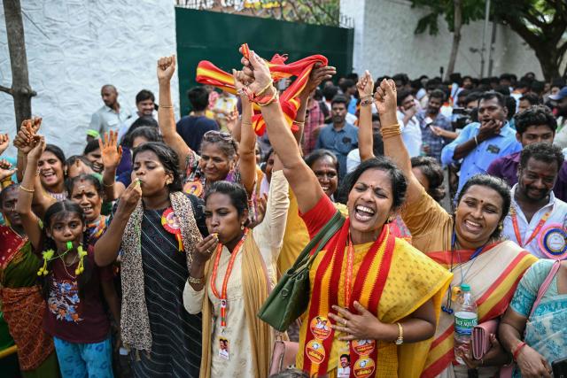 Supporters and members of Indian actor C. Joseph Vijay's Tamilaga Vettri Kazhagam (TVK) party celebrate after TVK leads in the vote counting for the Tamil Nadu Legislative Assembly elections in Chennai on May 4, 2026. Votes were being counted under tight security in the state of 100 million people, one of five states and territories that held elections in April and May where results were also due on May 4. Veteran politician MK Stalin was trailing in the southern state of Tamil Nadu, where he was challenged by a political debutant -- film star C. Joseph Vijay. (Photo by R. Satish BABU / AFP)