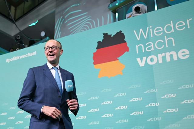 (FILES) Friedrich Merz, leader of Germany's conservative Christian Democratic Union (CDU) and then top candidate for chancellor, arrives to address supporters after the first exit polls in the German general elections were announced on TV during the electoral evening in Berlin on February 23, 2025. A year ago, German lawmakers elected conservative Friedrich Merz as chancellor. The chancellor had vowed to diminish the appeal of the country's far-right AfD party with two main strategies -- taking a tough stance on immigration to outflank the far-right party on the issue, and aiming to enact bold reforms to prove that centrist parties are still capable of acting. Tighter immigration rules have led to a significant decrease in arrivals -- but the chancellor does not appear to be benefitting political. Meanwhile the reform drive has stalled due to bickering between the conservative CDU and the social democratic SPD coalition parties, with the long-struggling economy making a slower than expected recovery. (Photo by INA FASSBENDER / AFP)