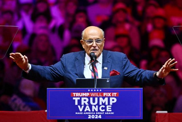 (FILES) Former Trump lawyer Rudy Giuliani speaks during a campaign rally for former US President and Republican presidential candidate Donald Trump at Madison Square Garden in New York on October 27, 2024. Former New York mayor Rudy Giuliani is hospitalized in "critical but stable condition," his spokesman said on May, 2026, without disclosing what ails the 81-year-old former politician. (Photo by ANGELA WEISS / AFP)