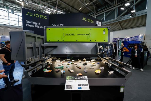 The KI Varisort + flex machine by Sesotec is on display at the IFAT Munich, a trade fair dedicated to environmental technologies across water, wastewater, waste and resource management, in Munich, southern Germany, on May 4, 2026. According to organisers, more than 3,000 exhibitors from more than 60 countries are presenting their strategies and innovations during the fair running until May 7, 2026. (Photo by Michaela STACHE / AFP)