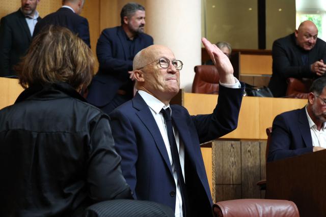 Newly elected President of the Corsican Exective Council Gilles Giovannangeli waves during his election at the Corsican Assembly in Ajaccio, on the French Mediterranean island of Corsica on May 4, 2026. (Photo by Pascal POCHARD-CASABIANCA / AFP)